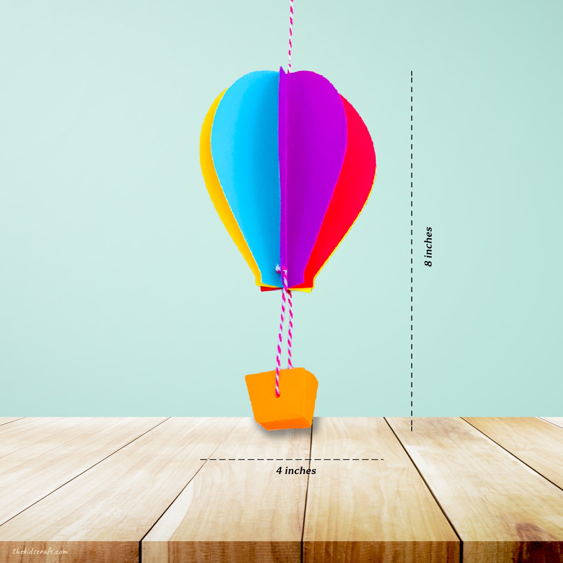 This picture shows The Kids Craft's Cherish the Rainbow Craft Kit - 3D Hot Air Balloon that your kid will be able to create once they are done.  Let your kid be a creator with this Craft Kit Box - The Kids Craft, a Creativeana LLC company creation. Your kid will love The Kids Craft's Cherish The Rainbow Crafts as they create their own hot air balloon, decorate their rainbow, create a bracelet, and create their art masterpiece.