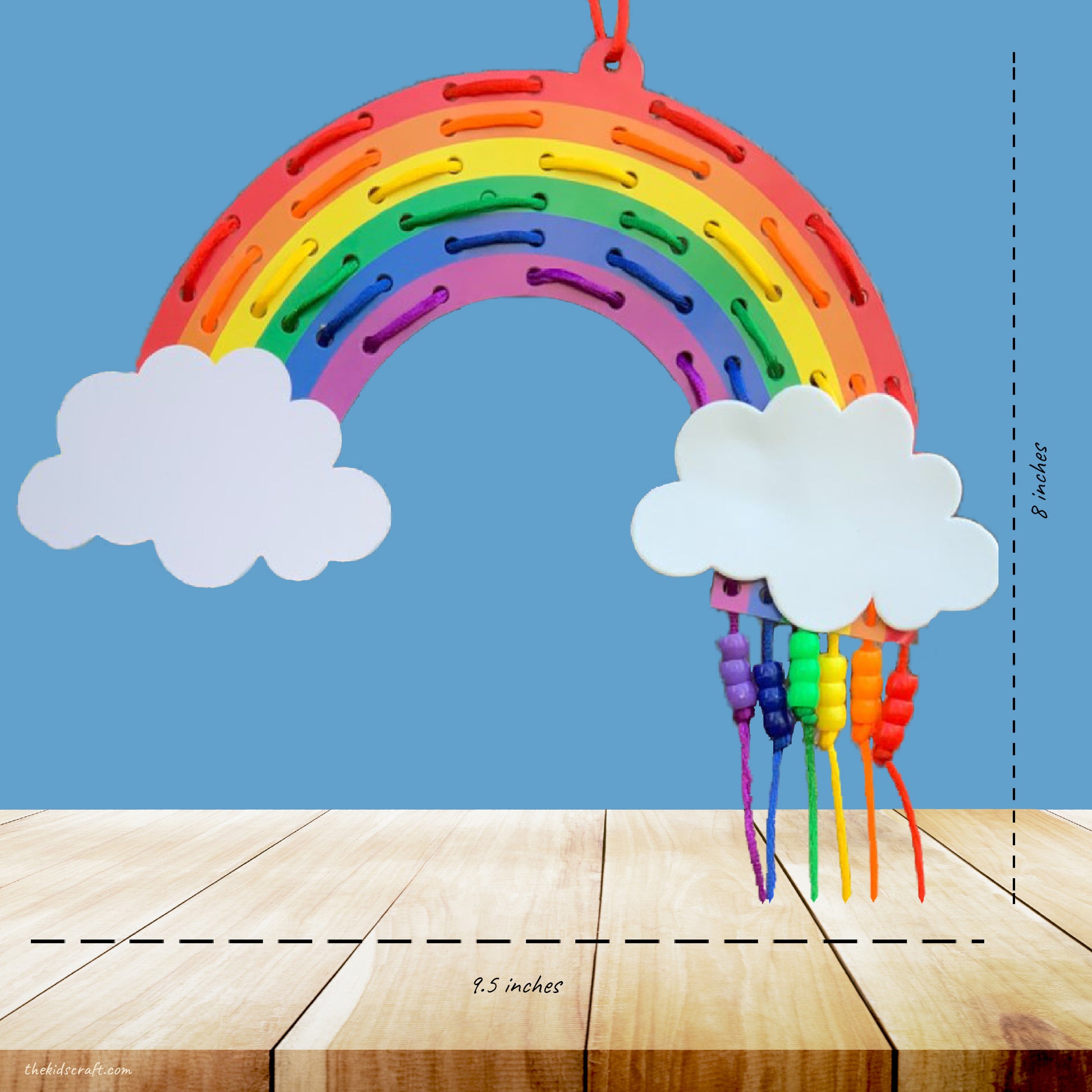 This picture shows The Kids Craft's Cherish the Rainbow Craft Kit - Rainbow Lacing Craft that your kid will be able to create once they are done.  Let your kid be a creator with this Craft Kit Box - The Kids Craft, a Creativeana LLC company creation. Your kid will love The Kids Craft's Cherish The Rainbow Crafts as they create their own hot air balloon, decorate their rainbow, create a bracelet, and create their art masterpiece.